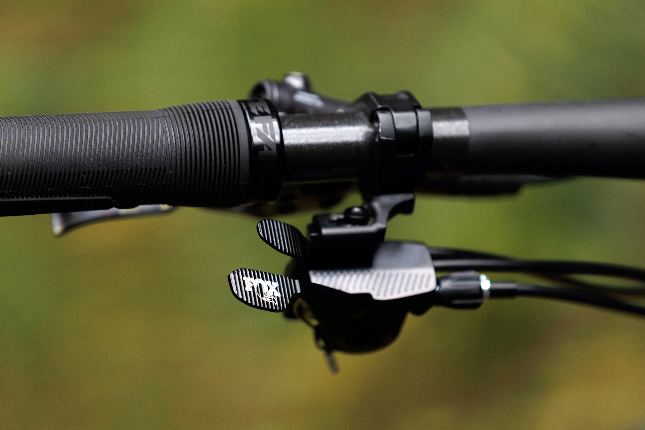 fox twin stick dual function dropper lever with remote suspension lockout.