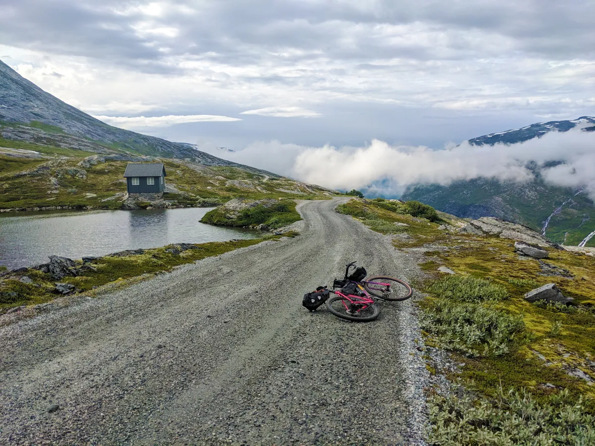 Bright Midnight 1,000km Norweigan bikepacking ultra race 15 Bike laid down on gravel path in Norway