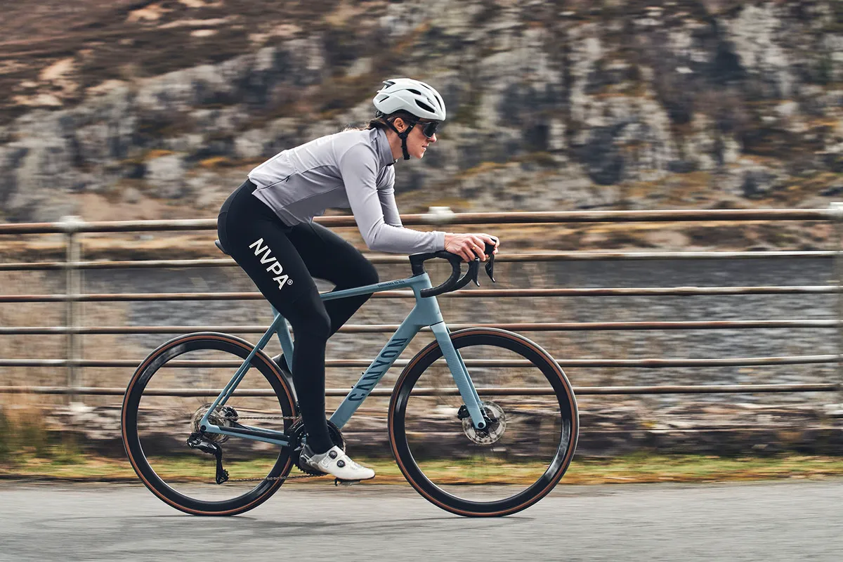 Male cycist in grey top riding the Canyon Endurace CF SLX 8 Di2 road bike
