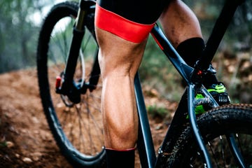 close up of mountainbiker on forest trail