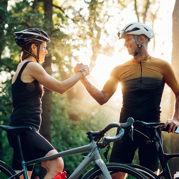 couple getting ready for a race on their bicycles