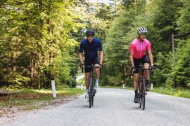 energetic caucasian recreational road cyclists cycling in the nature on a beautiful summer day