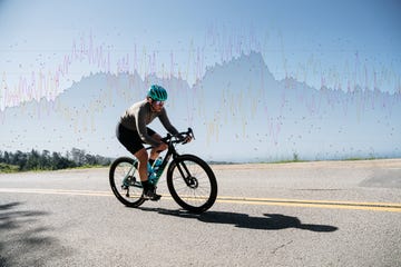 cyclist on hill with power metrics overlaid in background