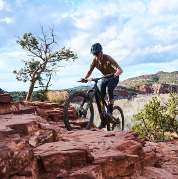 BKE a man riding a bike on a rocky terrain