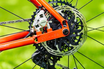 a sram red disc brake caliper on a stinner titanium bike