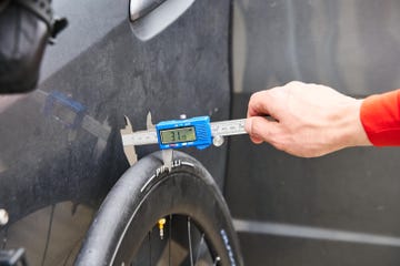 measuring the width of a bicycle tire using a caliper