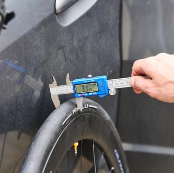 measuring the width of a bicycle tire using a caliper measuring the width of a bicycle tire using a caliper